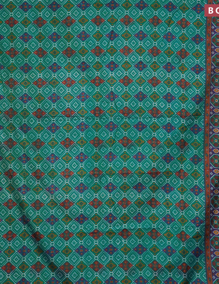 Semi tussar saree teal green and dual shade of blue with allover ikat prints and zari woven border