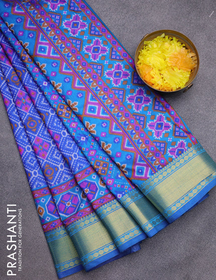 Semi tussar saree blue and cs blue with allover ikat prints and zari woven border