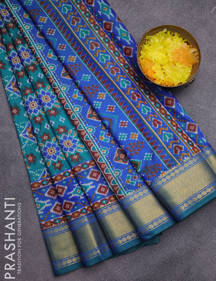 Semi tussar saree teal green and dual shade of blue with allover ikat prints and zari woven border