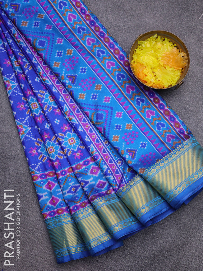 Semi tussar saree blue and cs blue with allover ikat prints and zari woven border