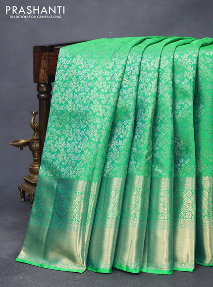 Pure kanjivaram silk saree dual shade of green with allover zari woven brocade weaves and long zari woven border