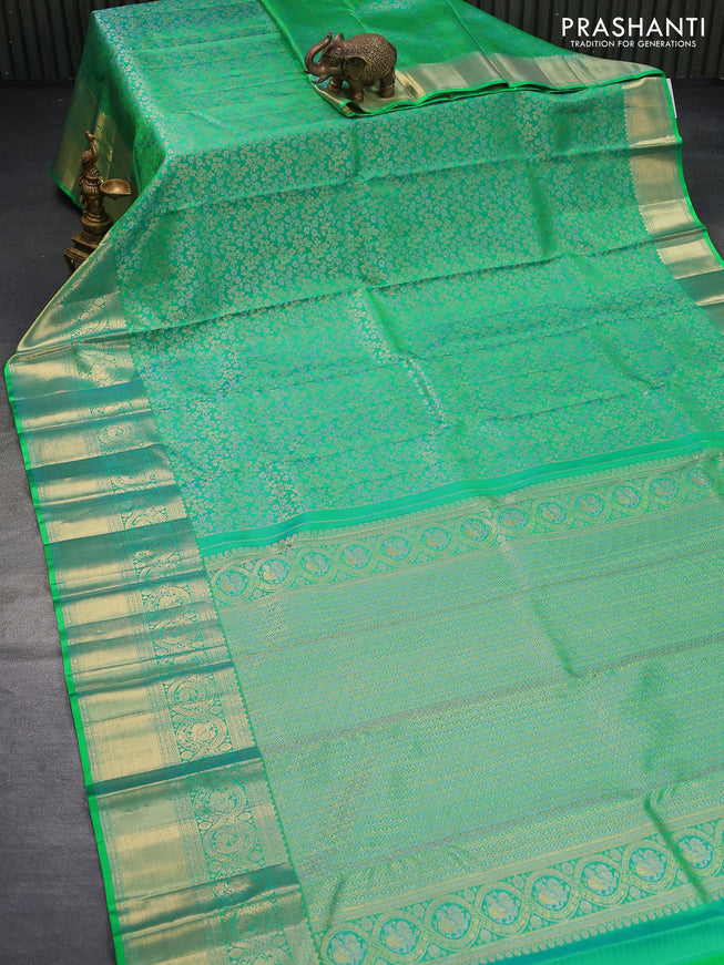 Pure kanjivaram silk saree dual shade of green with allover zari woven brocade weaves and long zari woven border