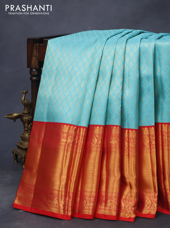 Pure kanjivaram silk saree light blue and red with allover zari woven brocade weaves and long zari woven border