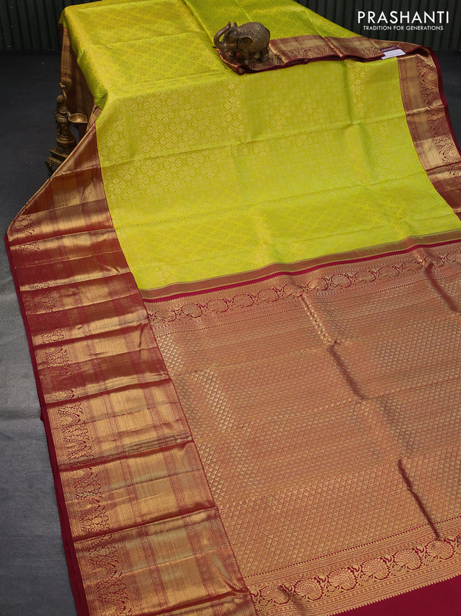 Pure kanjivaram silk saree fluorescent green and maroon with allover zari woven brocade weaves and long zari woven border