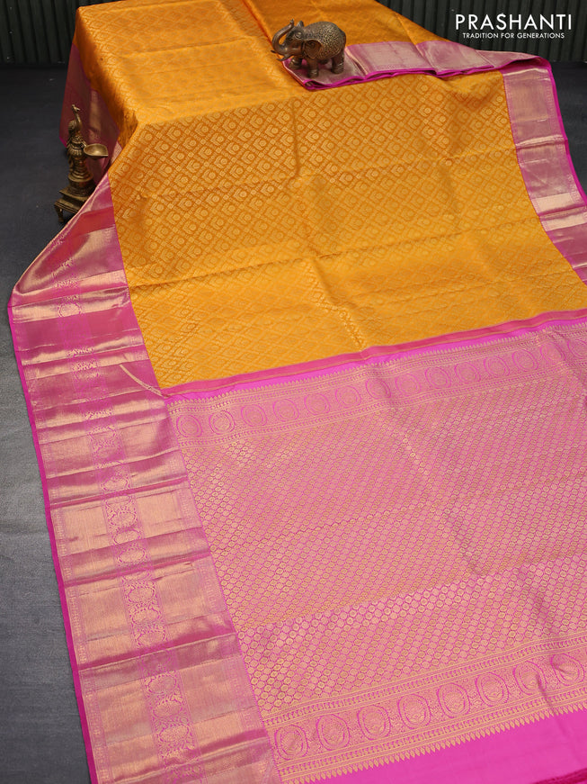 Pure kanjivaram silk saree mustard yellow and pink with allover zari woven brocade weaves and long zari woven border