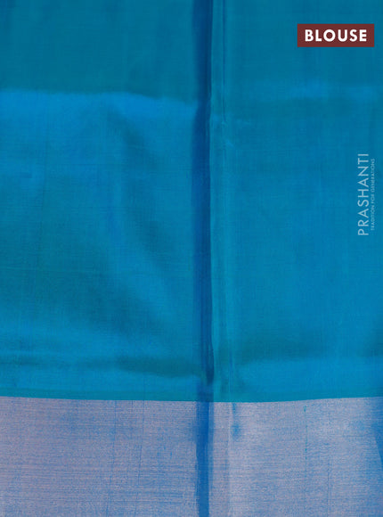 Pure uppada silk saree blue and dual shade of teal blue with allover silver zari woven paisley buttas and long rich silver zari woven border