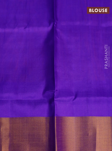 Pure uppada silk saree dual shade of bluish rust and blue with silver & gold zari woven buttas and zari woven border