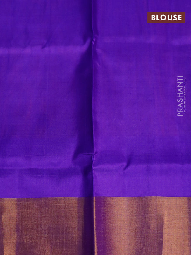 Pure uppada silk saree dual shade of bluish rust and blue with silver & gold zari woven buttas and zari woven border