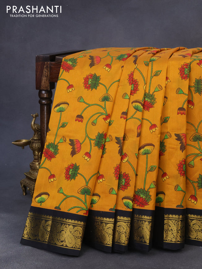 Silk cotton saree mustard yellow and black with allover kalamkari prints and zari woven korvai border