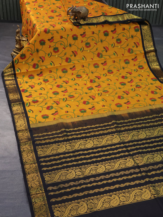 Silk cotton saree mustard yellow and black with allover kalamkari prints and zari woven korvai border