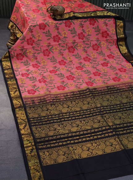 Silk cotton saree peach pink and black with allover floral prints and zari woven korvai border