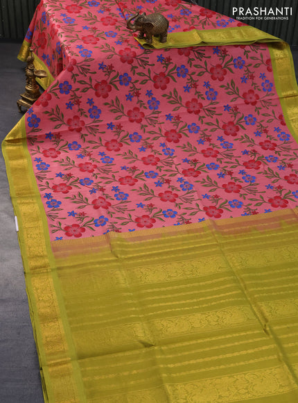 Silk cotton saree peach pink and light green with allover floral prints and zari woven korvai border