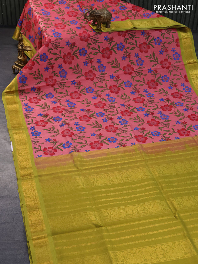 Silk cotton saree peach pink and light green with allover floral prints and zari woven korvai border