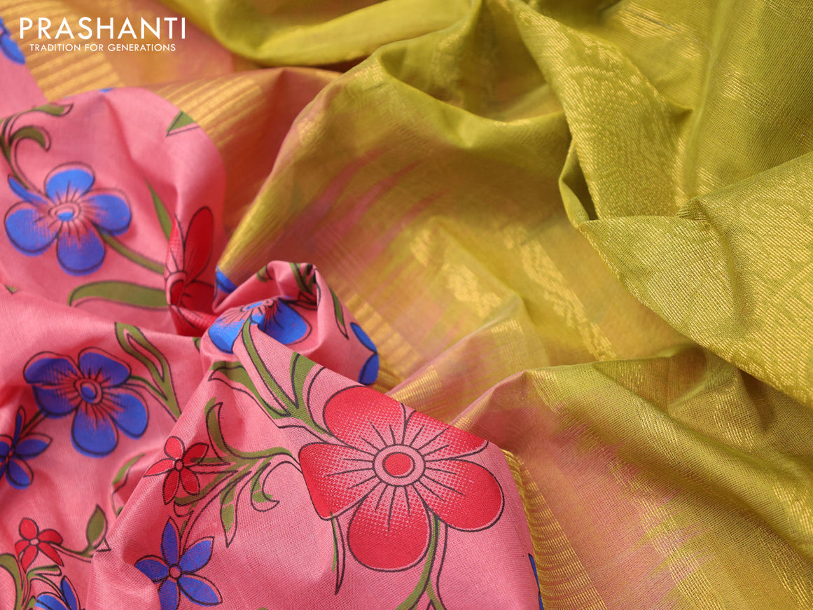 Silk cotton saree peach pink and light green with allover floral prints and zari woven korvai border