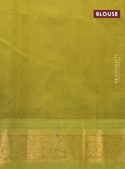 Silk cotton saree peach pink and light green with allover floral prints and zari woven korvai border