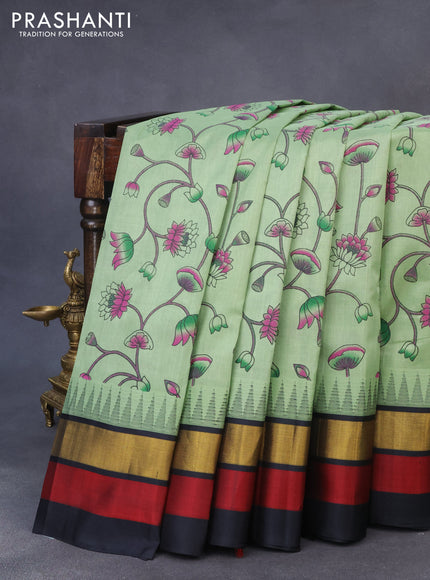 Silk cotton saree pastel green and black with allover pichwai prints and temple design zari woven simple border