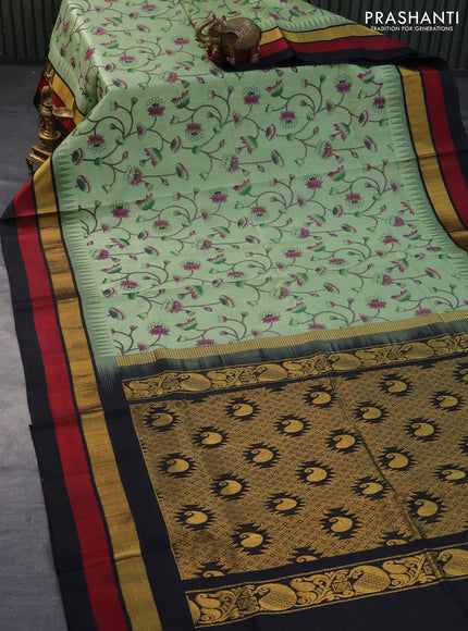 Silk cotton saree pastel green and black with allover pichwai prints and temple design zari woven simple border