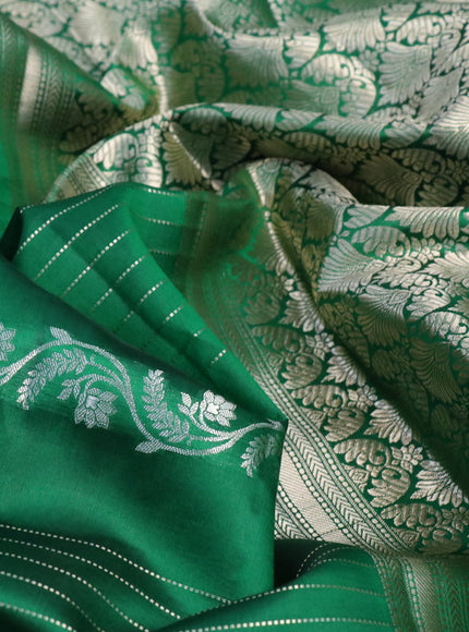 Chiniya silk saree green with allover zari weaves and zari woven simple border