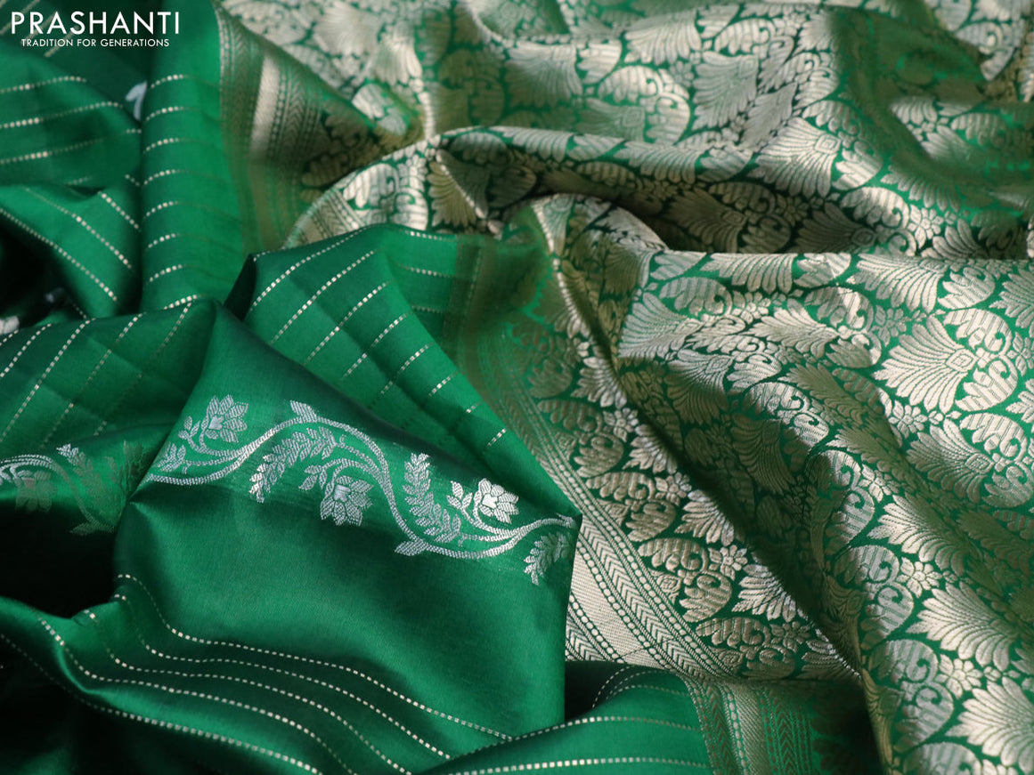 Chiniya silk saree green with allover zari weaves and zari woven simple border