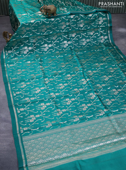 Chiniya silk saree green with allover silver zari weaves and zari woven simple border