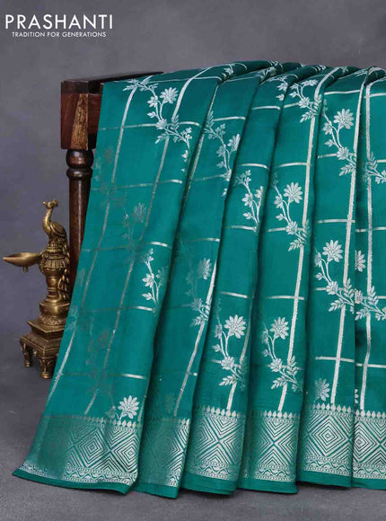 Chiniya silk saree teal green with allover silver zari checks & weaves and silver zari woven border