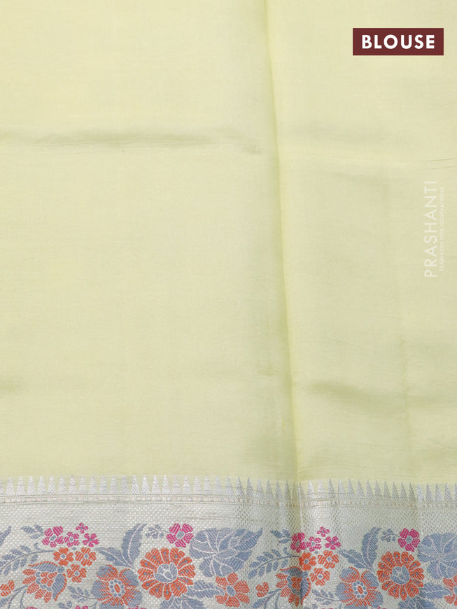 Chiniya silk saree pale yellow with allover silver zari weaves and floral design zari border