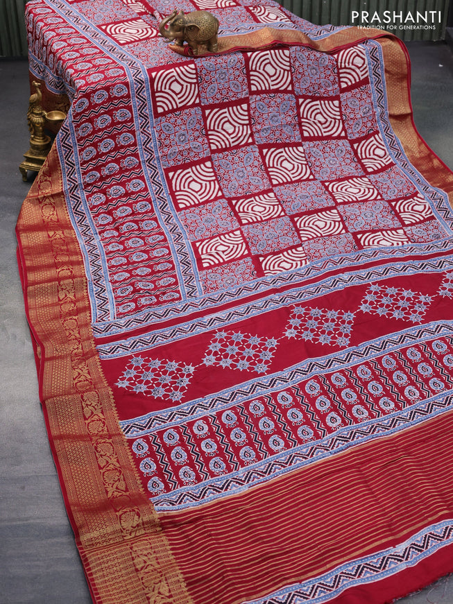 Dola silk saree maroon with allover ajrakh prints and zari woven border