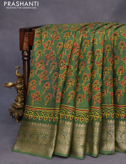 Dola silk saree green with allover ajrakh prints and zari woven border