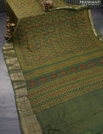 Dola silk saree green with allover ajrakh prints and zari woven border