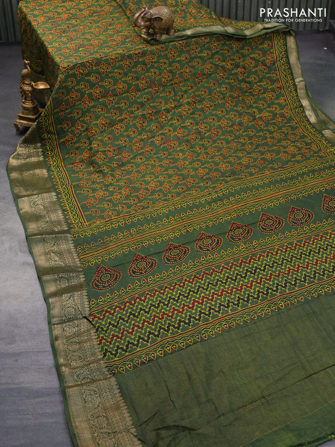 Dola silk saree green with allover ajrakh prints and zari woven border