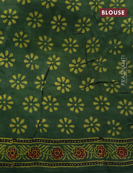 Dola silk saree green with allover ajrakh prints and zari woven border