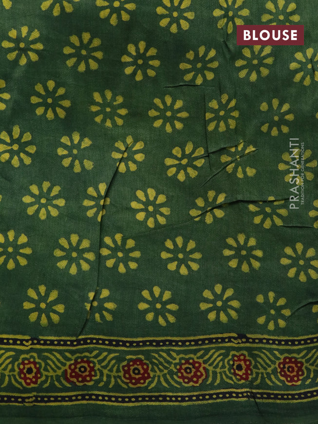 Dola silk saree green with allover ajrakh prints and zari woven border