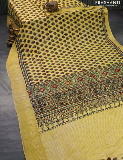 Dola silk saree yellow with allover ajrakh prints and zari woven border