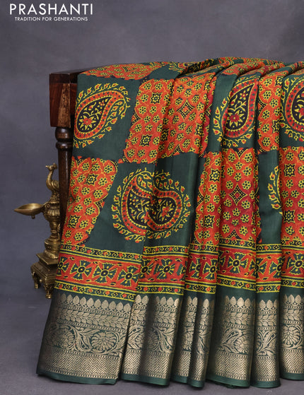 Dola silk saree dark green with allover ajrakh prints and zari woven border