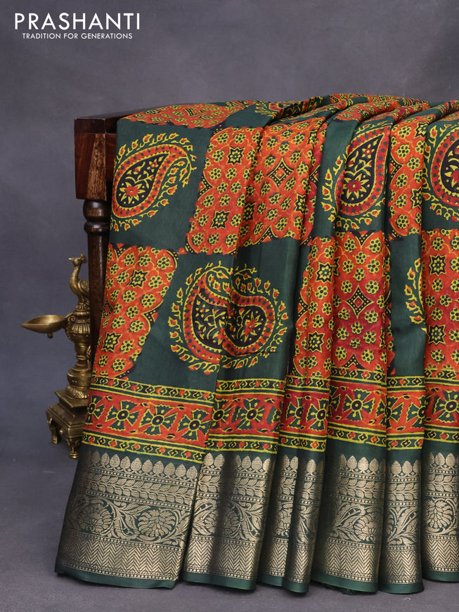 Dola silk saree dark green with allover ajrakh prints and zari woven border