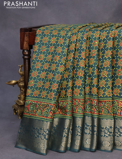 Dola silk saree green with allover ajrakh prints and zari woven border