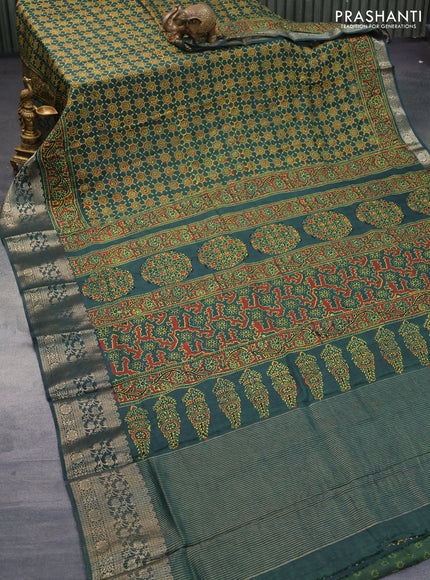 Dola silk saree green with allover ajrakh prints and zari woven border