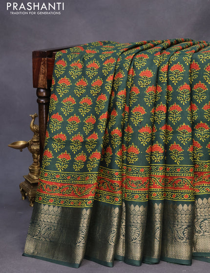 Dola silk saree green with allover ajrakh prints and zari woven border