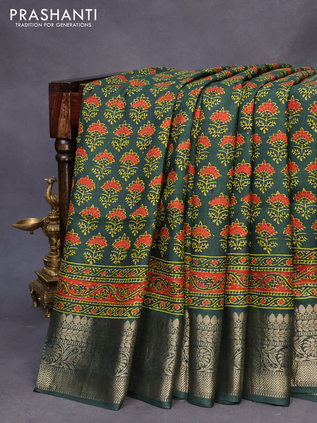 Dola silk saree green with allover ajrakh prints and zari woven border