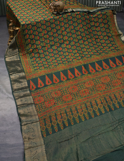 Dola silk saree green with allover ajrakh prints and zari woven border