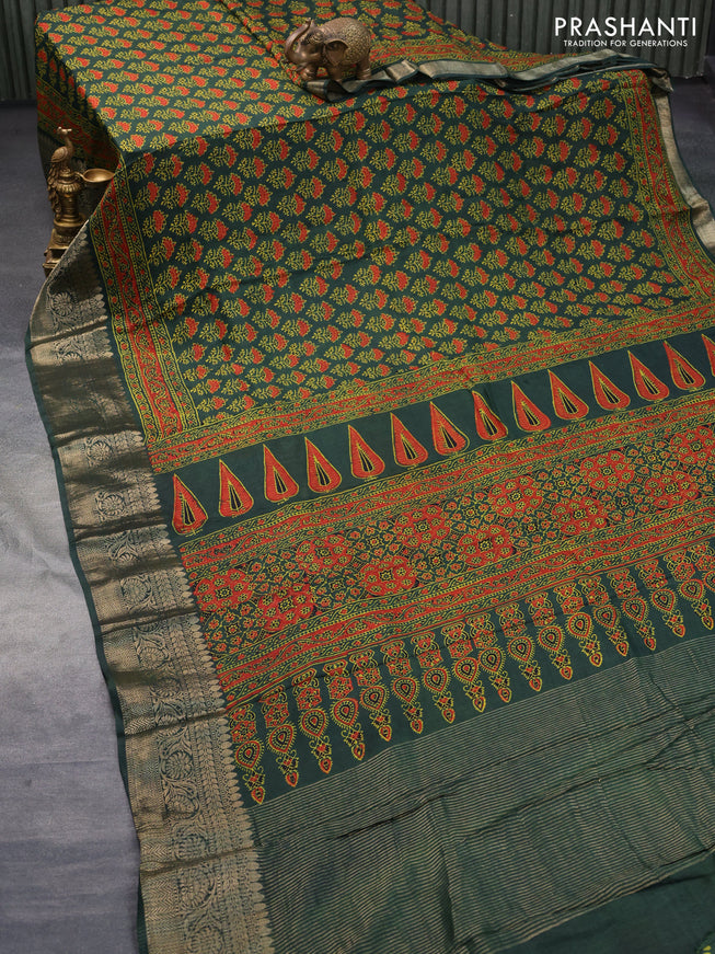 Dola silk saree green with allover ajrakh prints and zari woven border