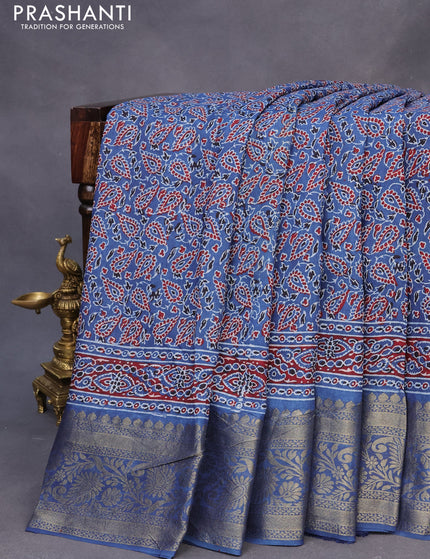 Dola silk saree blue and maroon with allover ajrakh prints and zari woven border