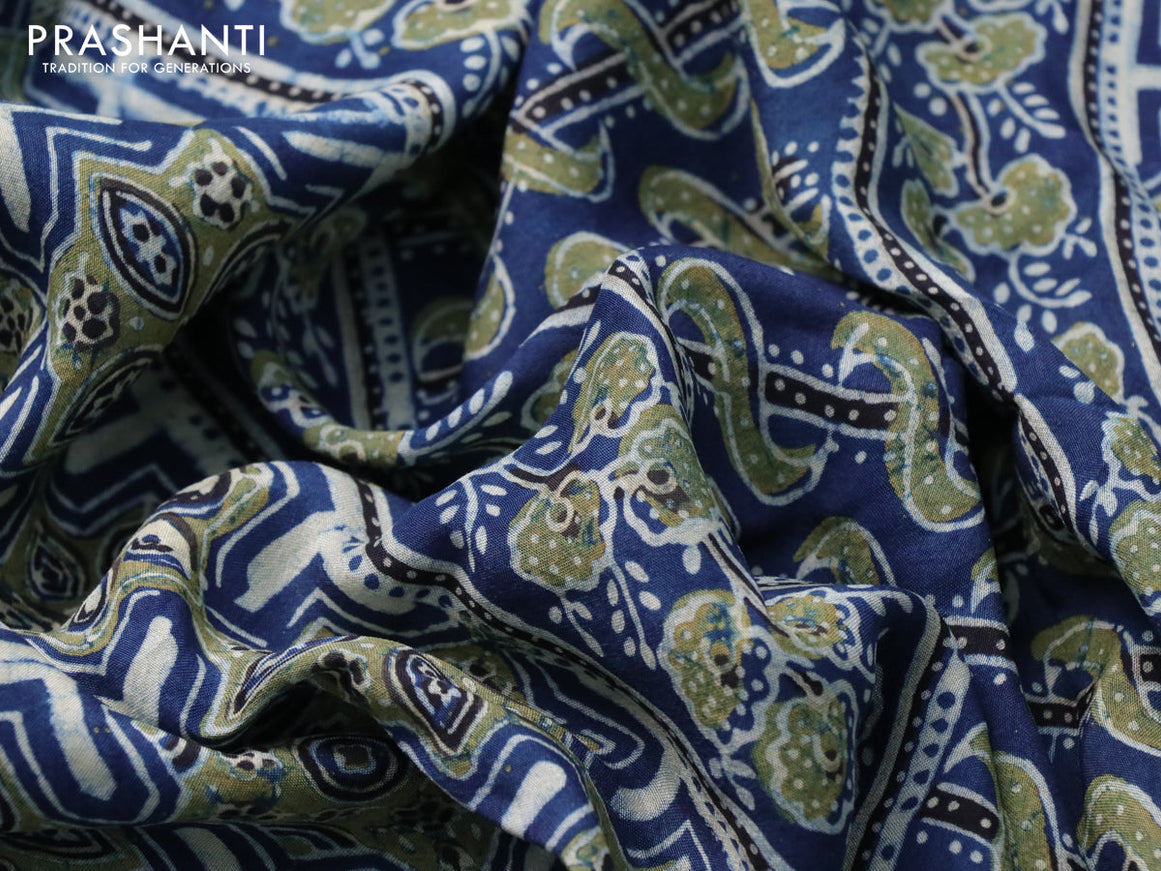 Dola silk saree blue and black with allover ajrakh prints and printed border