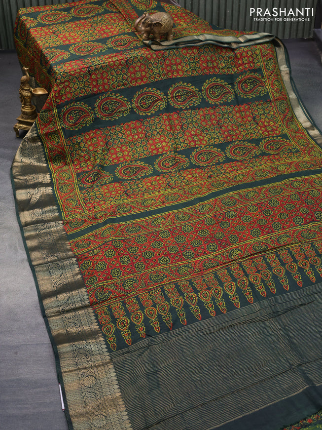 Dola silk saree dark green with allover ajrakh prints and zari woven border