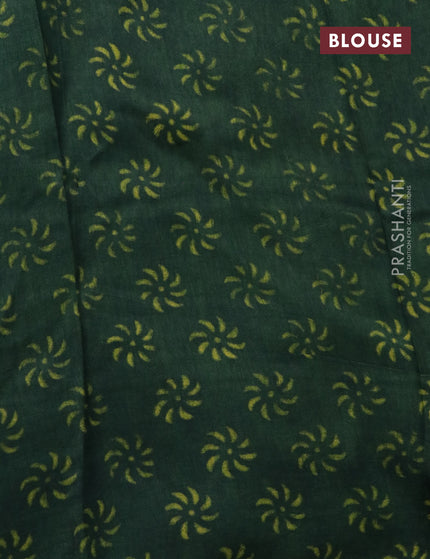 Dola silk saree dark green with allover ajrakh prints and zari woven border