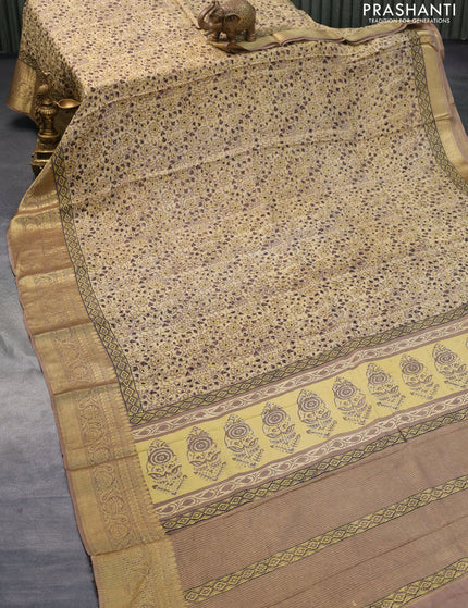 Dola silk saree beige and brown with allover ajrakh prints and zari woven border