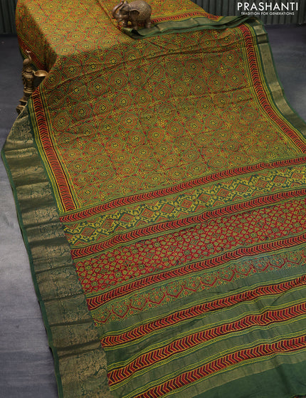 Dola silk saree green and red with allover ajrakh prints and zari woven border