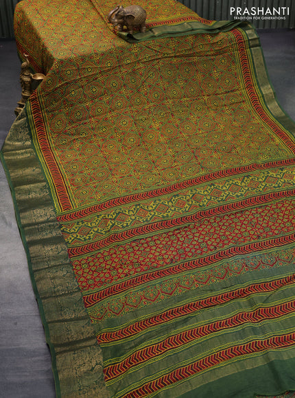 Dola silk saree green and red with allover ajrakh prints and zari woven border