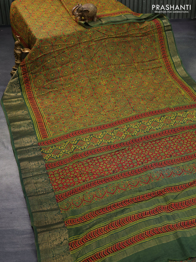 Dola silk saree green and red with allover ajrakh prints and zari woven border