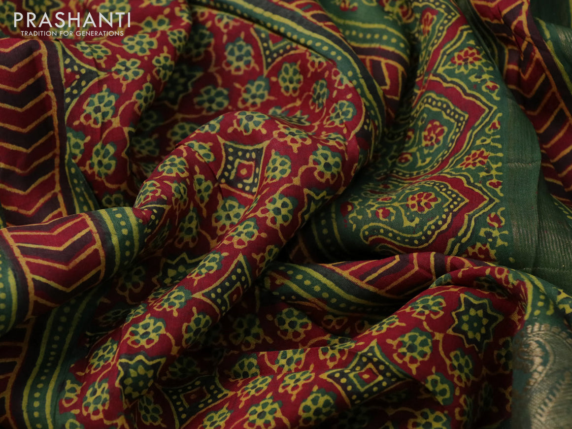 Dola silk saree green and red with allover ajrakh prints and zari woven border